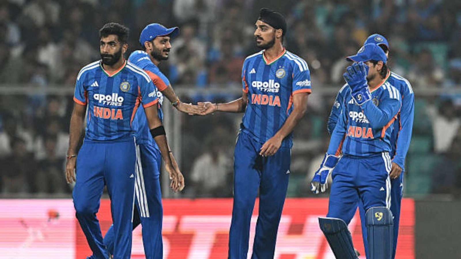 Team India to follow protocol, will travel to Sri Lanka despite Pakistan's boycott of T20 WC clash: Report India's Arshdeep Singh (C) celebrates with teammates after taking the wicket of New Zealand's Tim Seifert during the fifth and final Twenty20 international cricket match between India and New Zealand (via Getty)