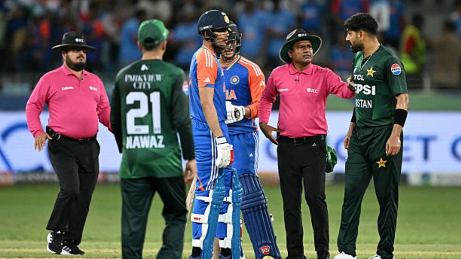 'It will not be right...': BCCI Secretary Devajit Saikia reacts to Pakistan's boycott of T20 WC clash vs India Pakistan's Haris Rauf (R) speaks with India's Abhishek Sharma (3R) as Shubman Gill (3L) watches during the Asia Cup 2025 Super Four Twenty20 international cricket match between India and Pakistan (via Getty)