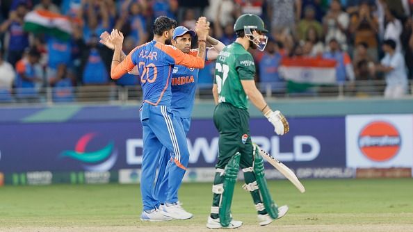 Axar Patel of India and Surya Kumar Yadhav captain of India celebrates the wicket of Muhammad Hussain Tallat of Pakistan 