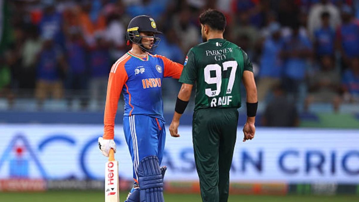 Abhishek Sharma of India speaks to Haris Rauf of Pakistan during the Asia cup match between India and Pakistan at Dubai International Stadium (via Getty)