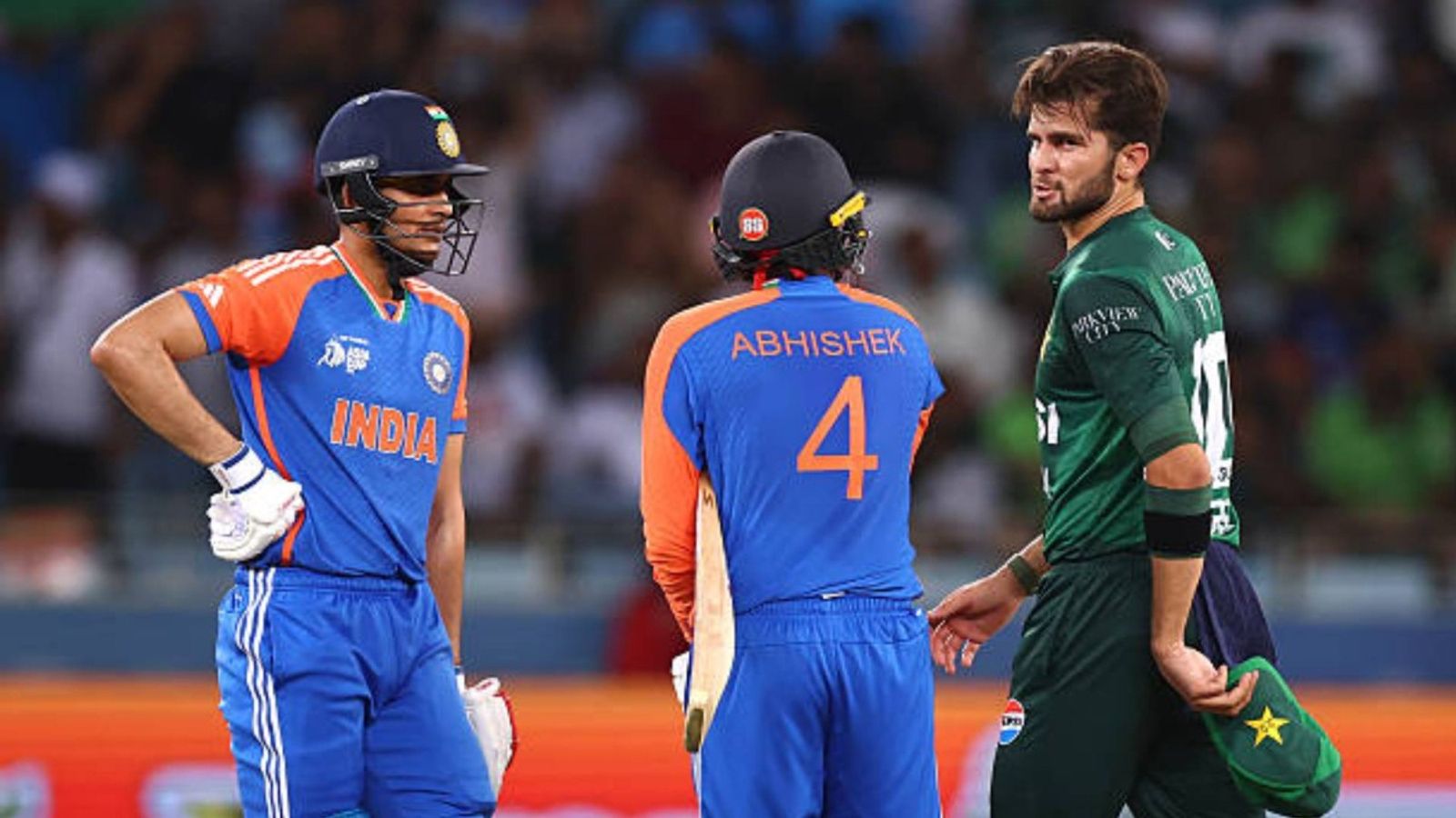PCB to face huge financial losses if they boycott T20 World Cup clash vs India: Report Shaheen Shah Afridi of Pakistan speaks to Abhishek Sharma of India and Shubman Gill of India during the Asia cup match between India and Pakistan at Dubai International Stadium (via Getty)