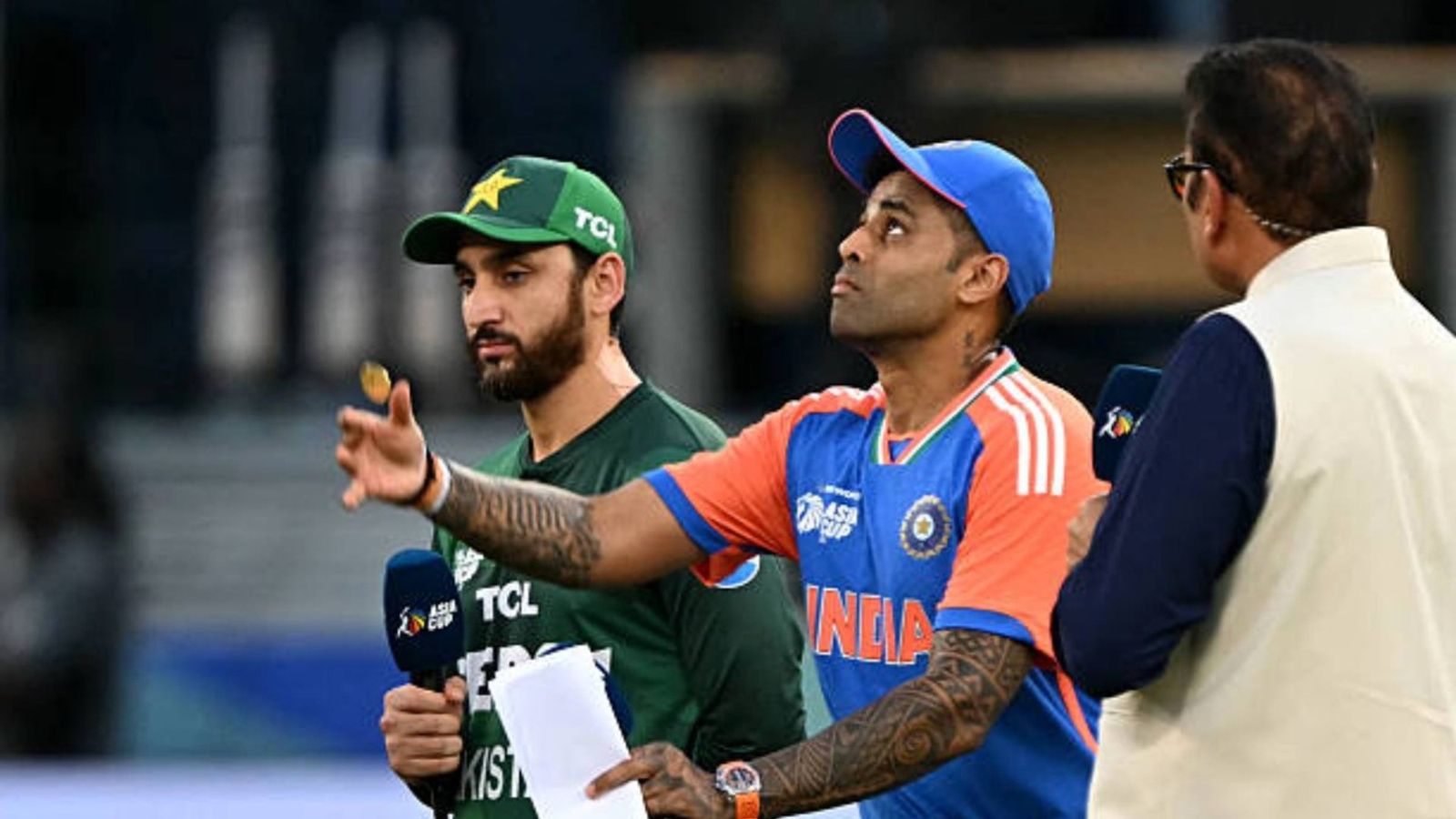 'We have taken this stand after...': Pakistan PM explains reason behind boycotting T20 WC clash vs India India's captain Suryakumar Yadav (C) tosses the coin at the start of the Asia Cup 2025 Twenty20 international cricket match between India and Pakistan at the Dubai International Stadium in Dubai (via Getty)