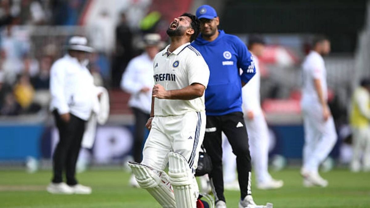 India batsman Rishabh Pant reacts in pain after taking a blow to the foo during day one of the Fourth Test Match between England and India at Emirates Old Trafford (via Getty)