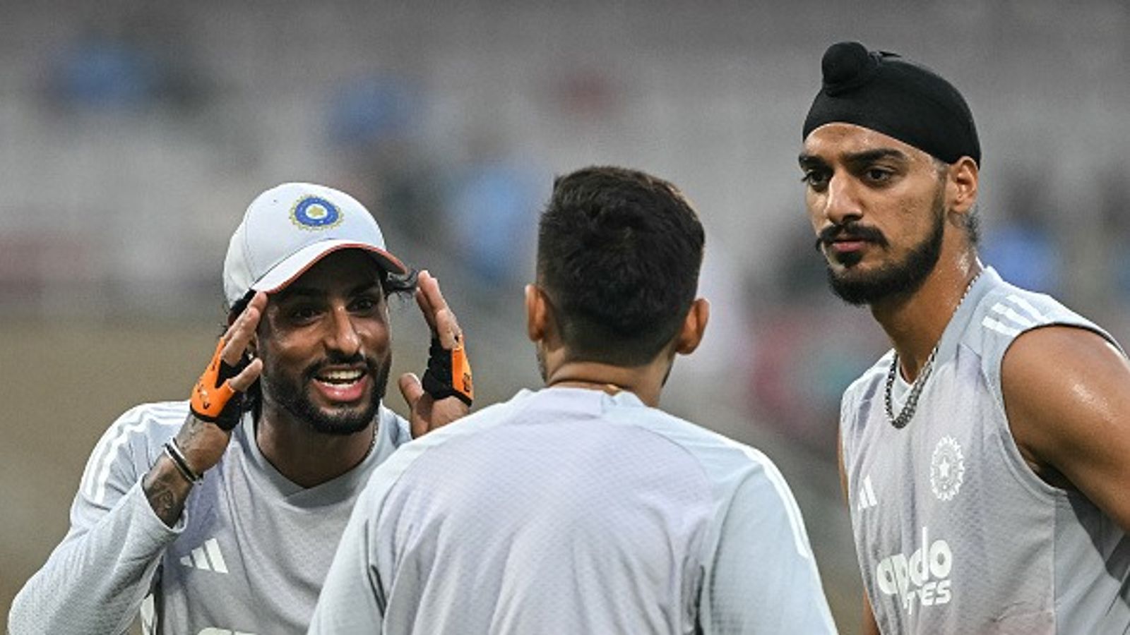 WATCH: Suryakumar Yadav's hilarious clip lauding Arshdeep Singh's batting in T20 World Cup 2026 clash vs USA goes viral Tilak Varma (L) speaks with captain Suryakumar Yadav (C) as Arshdeep Singh looks on (Getty)