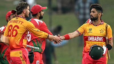T20 World Cup 2026: Brian Bennett, Blessing Muzarabani star as Zimbabwe beat Oman by eight wickets Zimbabwe's captain Sikandar Raza (R) shakes hands with his teammate Brian Bennett (L) after their team's win in the 2026 ICC Men's T20 Cricket World Cup group stage match between Zimbabwe and Oman (Getty)