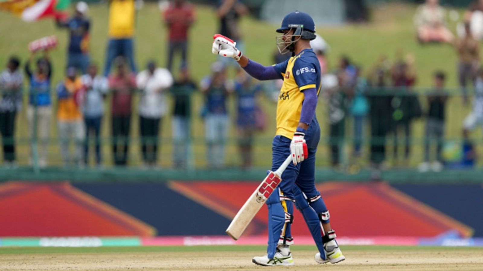Dasun Shanaka slams fastest fifty for Sri Lanka in T20Is, helps post 4th highest score in T20 World Cup history Dasun Shanaka of Sri Lanka acknowledges his team after reaching 50 runs during the ICC Men's T20 World Cup 2026 match agianst Oman at Pallekele Cricket Stadium on February 12, 2026 in Kandy, Sri Lanka.