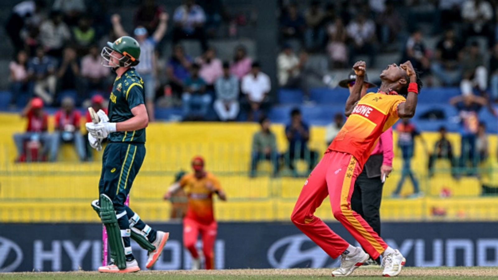 Zimbabwe stun Australia with a 23-run win in Colombo, repeat T20 WC 2007's feat to shake up points table Zimbabwe's Blessing Muzarabani (R) celebrates after taking the wicket of Australia's Matt Renshaw during the 2026 ICC Men's T20 Cricket World Cup group stage match at the R Premadasa Stadium in Colombo on February 13, 2026.