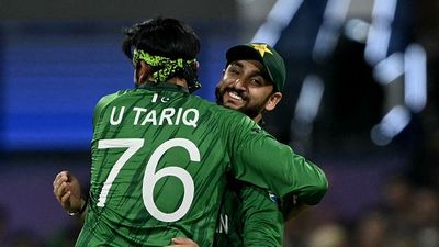 IND vs PAK: Salman Ali Agha breaks silence on Usman Tariq's bowling action controversy, labels him ‘Trump Card’ Pakistan's Usman Tariq celebrates with captain Salman Agha after taking the wicket of USA's Mohammad Mohsin during the 2026 ICC Men's T20 Cricket World Cup group stage match between Pakistan and USA (Getty)