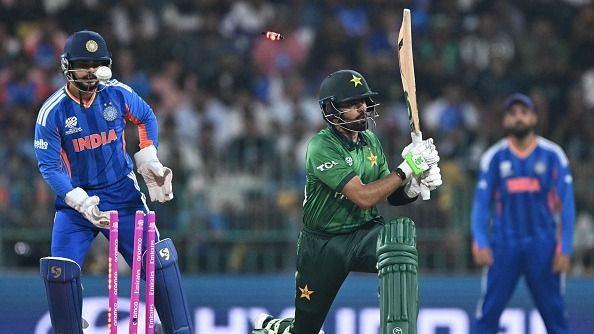 Pakistan's Babar Azam (R) is clean bowled by India's Axar Patel in this frame. (Getty)
