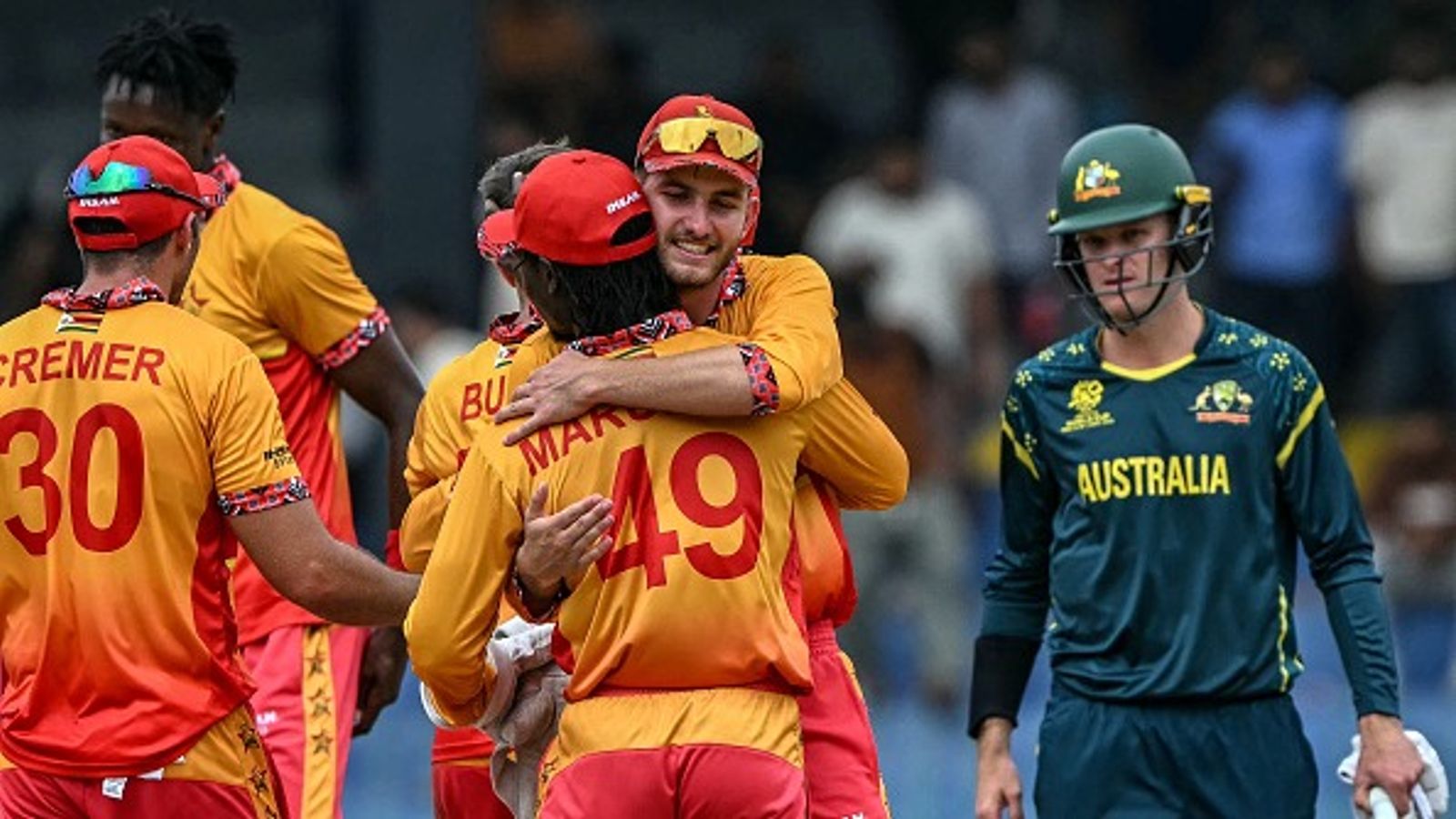 Big News: Australia knocked out of T20 World Cup 2026 as rain seals Zimbabwe’s Super 8 spot Zimbabwe's Brian Bennett (C, back) celebrates with teammates after their team's win in the 2026 ICC Men's T20 Cricket World Cup group stage match between Australia and Zimbabwe (getty)