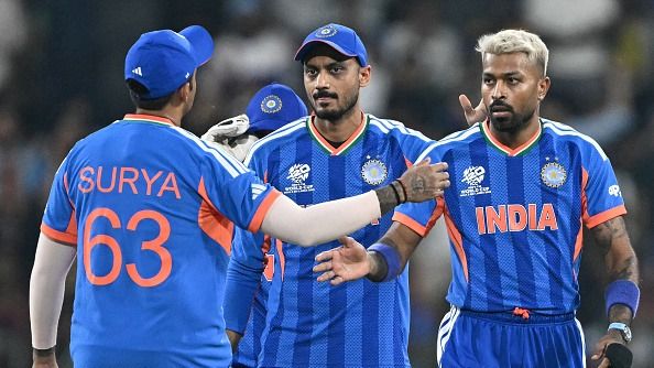  Hardik Pandya (R) celebrates with Axar Patel (C) and captain Suryakumar Yadav after taking the wicket of Pakistan's Sahibzada Farhan during the 2026 ICC Men's T20 Cricket World Cup (Getty)