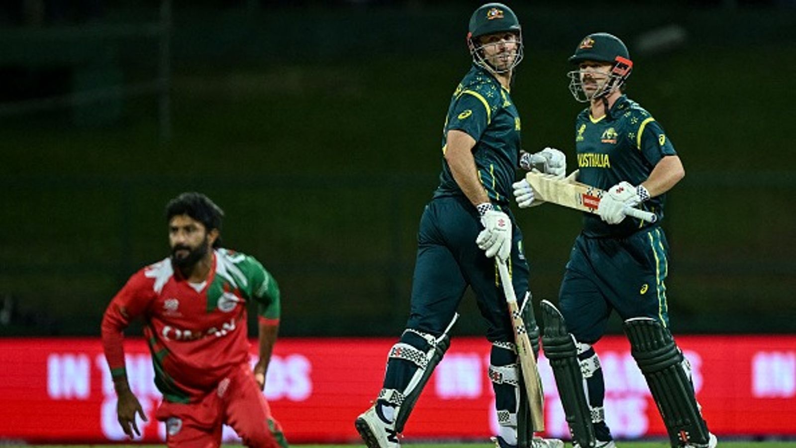 T20 World Cup: Wounded Australia end T20 World Cup campaign with roaring 9-wicket win over Oman Australia's Travis Head (R) and captain Mitchell Marsh (C) in this frame. (Getty)