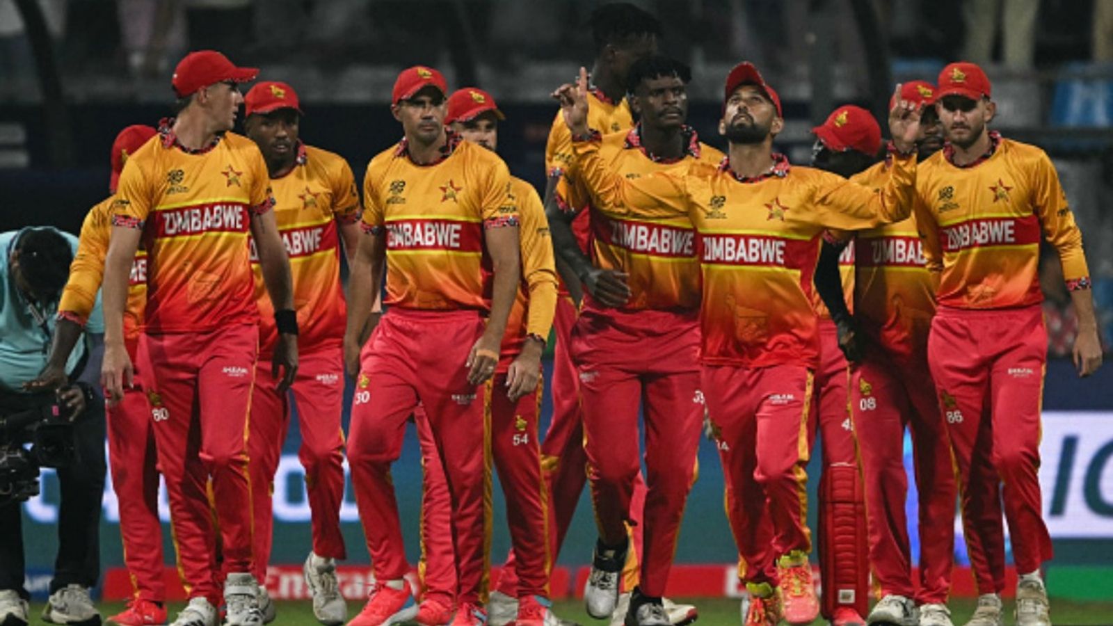 IND vs ZIM: Will no.1 T20I all-rounder play against India in must-win clash? Zimbabwe's captain Sikandar Raza (4R) enters the pitch with teammates before the start of the 2026 ICC Men's T20 World Cup Super 8 match against West Indies at the Wankhede Stadium in Mumbai on February 23, 2026.