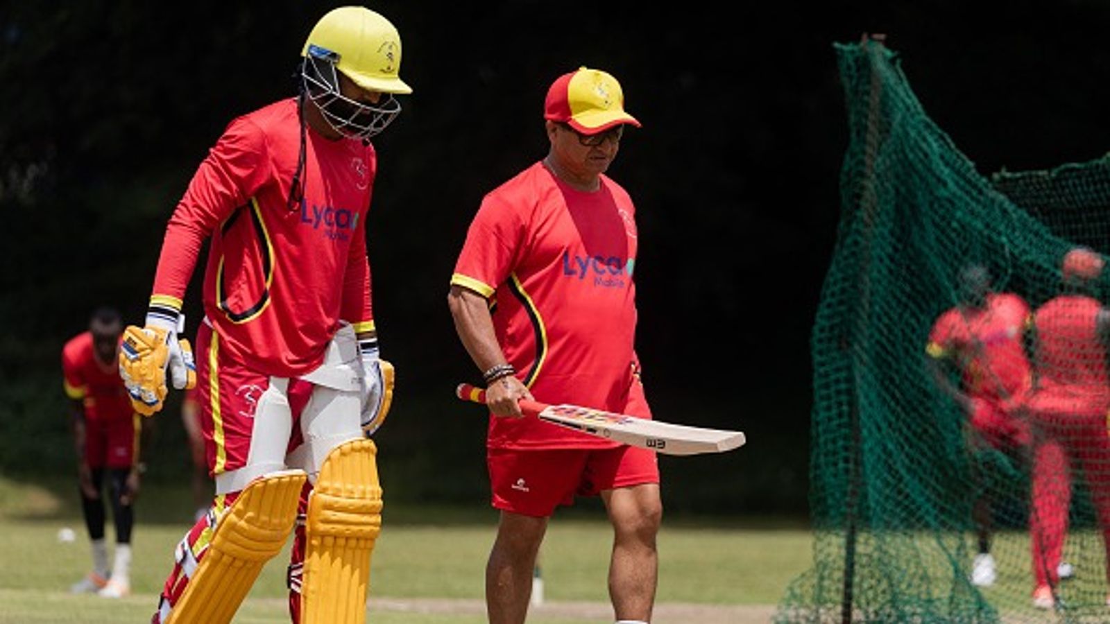 LSG hire ex-Uganda head coach as Jonty Rhodes' replacement to bolster fielding for IPL 2026 Uganda head coach Abhay Sharma (C) holds a bat while talking to a player during a practice session ahead of the ICC T20 World Cup at the Lugogo Cricket Oval in Kampala, on May 17, 2024.