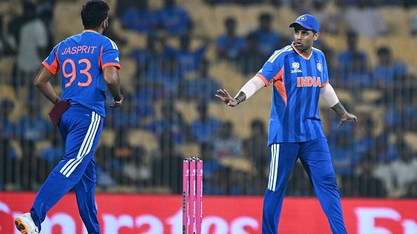 India's captain Suryakumar Yadav (R) gestures to teammate Jasprit Bumrah in this frame. (Getty)