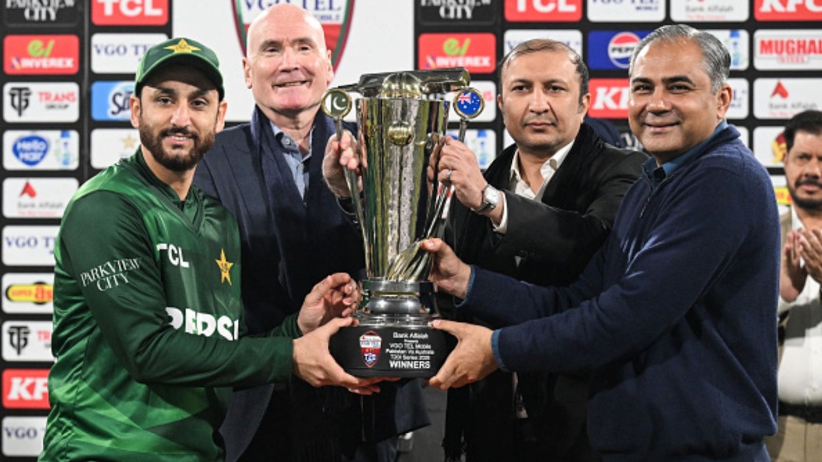 PCB slaps 5 million fine on Pakistan's T20 World Cup 2026 squad members after another debacle: Report Pakistan's captain Salman Agha (L) receives the trophy from Pakistan Cricket Board (PCB) chairman Mohsin Naqvi (R) after his team's win at the end of the third T20I against Australia at the Gaddafi Stadium in Lahore on February 1, 2026.