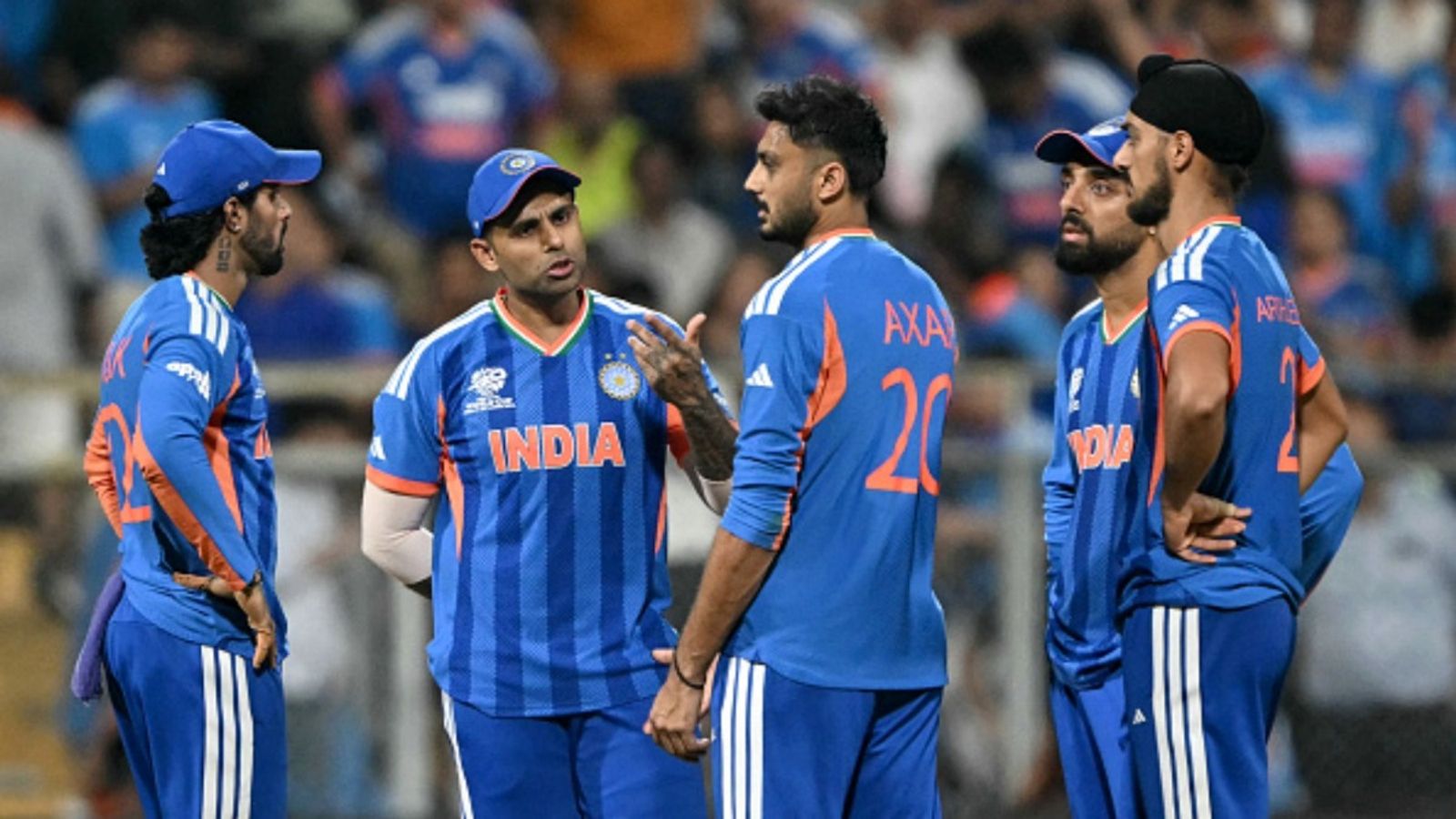 '5 chakke to nahi khaunga': Axar Patel expected to bowl final over vs England's centurion Jacob Bethell (L-R) India's Tilak Varma, captain Suryakumar Yadav, Axar Patel, Varun Chakravarthy and Arshdeep Singh gather during the 2026 ICC Men's T20 Cricket World Cup semi-final against England at the Wankhede Stadium in Mumbai on March 5, 2026.