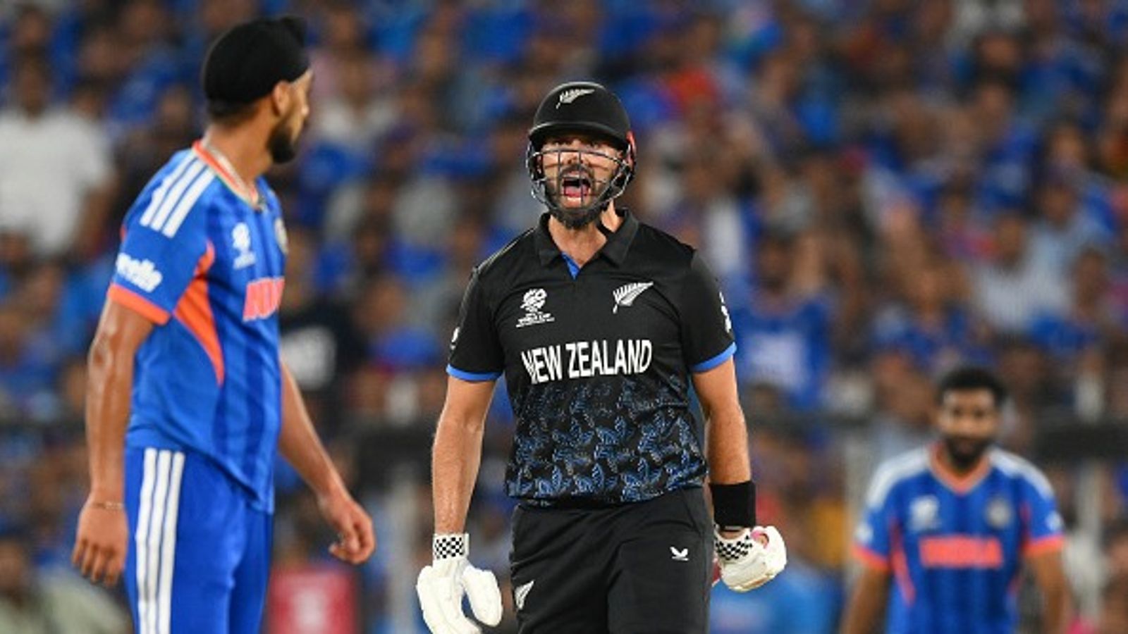 Arshdeep Singh opens up heated exchange with Daryl Mitchell, says 'I had to tell him it...' New Zealand's Daryl Mitchell (R) reacts towards India's Arshdeep Singh in this frame. (Getty)