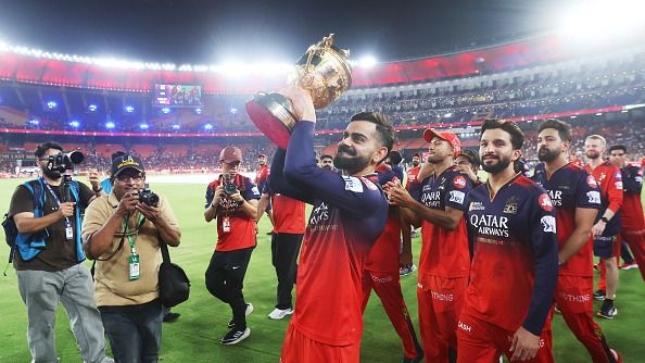  Virat Kohli of Royal Challengers Bengaluru lifts the IPL trophy following the trophy presentation in the 2025 IPL Final match between Royal Challengers Bengaluru and Punjab Kings at Narendra Modi Stadium (Getty)