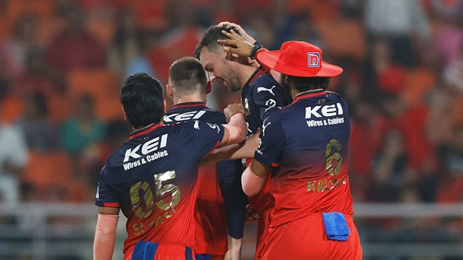 RCB hit by major concern ahead of IPL 2026 opener as star player faces fitness doubt, participation uncertain Josh Hazlewood of Royal Challengers Bengaluru celebrates with teammates after dismissing Josh Inglis of Punjab Kings during the 2025 IPL Qualifier Finals (Getty)