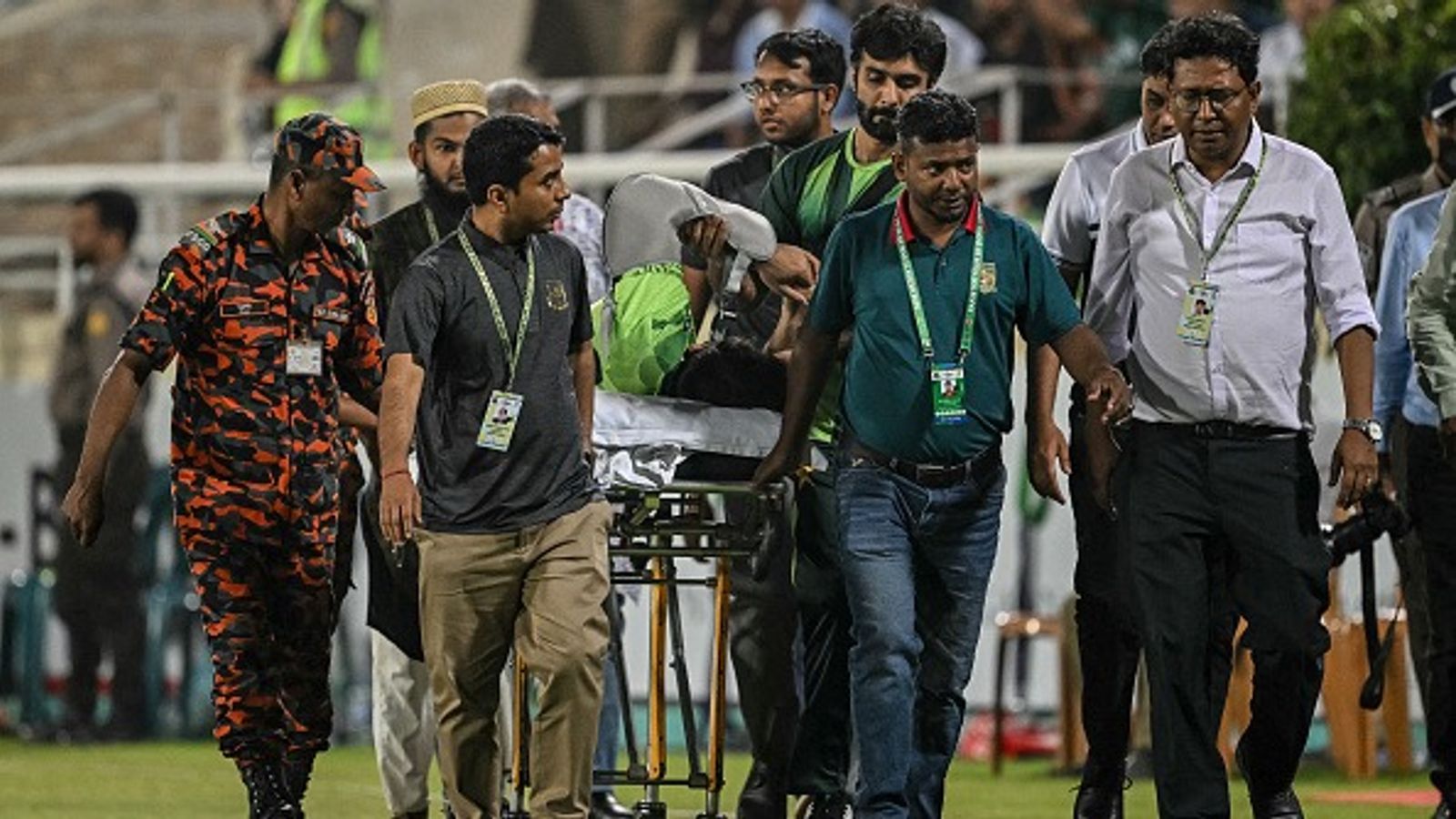 Scary scenes! Pakistani batter stretchered off the field after serious injury vs Bangladesh, rushed to hospital Pakistan's Hussain Talat (C) is taken off the field using a stretcher after getting injured while fielding during 2nd ODI vs Bangladesh. (Getty)