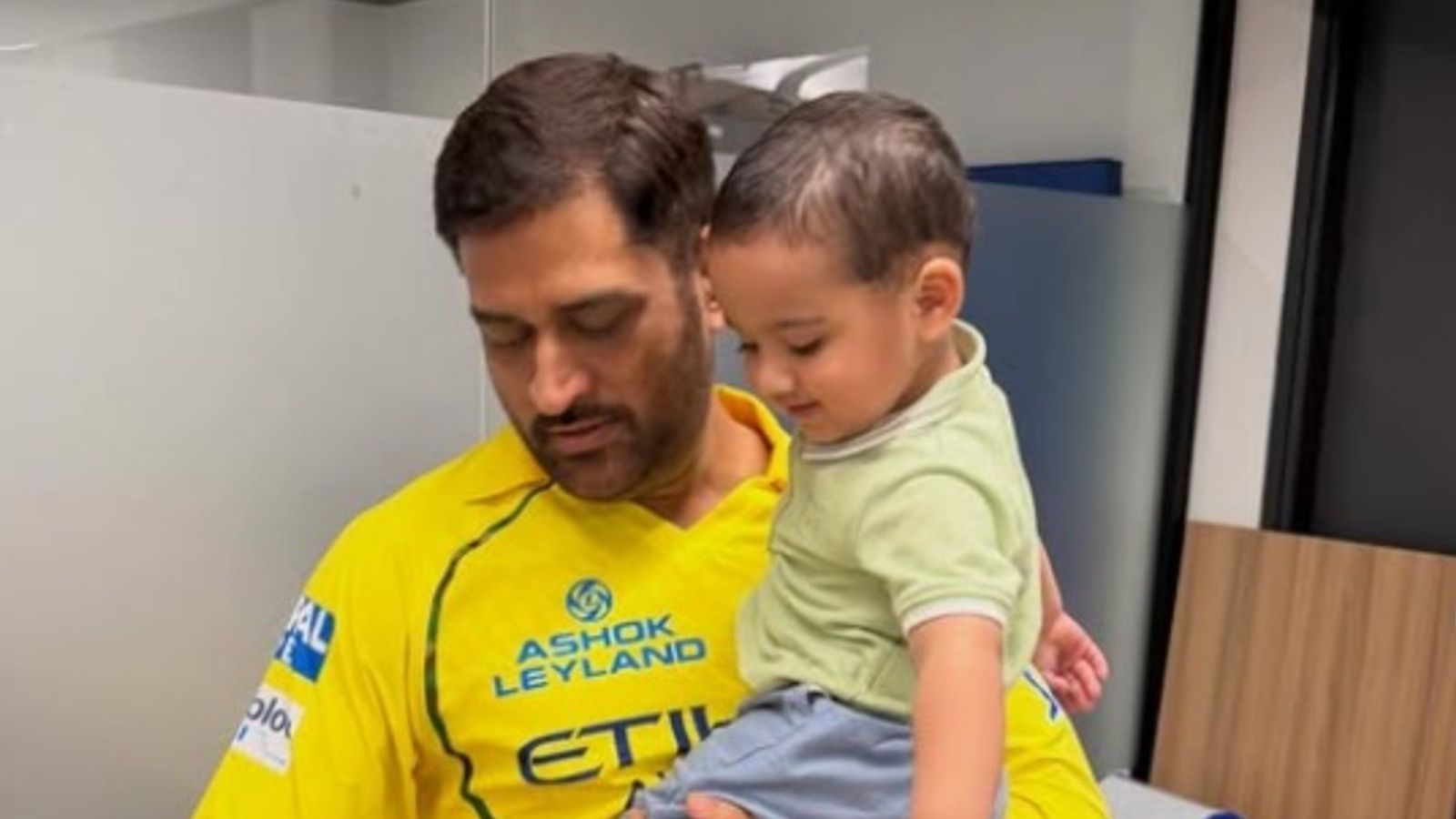 WATCH: MS Dhoni’s sweet bonding moment with Sarfaraz Khan’s son goes viral MS Dhoni along with Sarfaraz Khan's kid (Instagram)