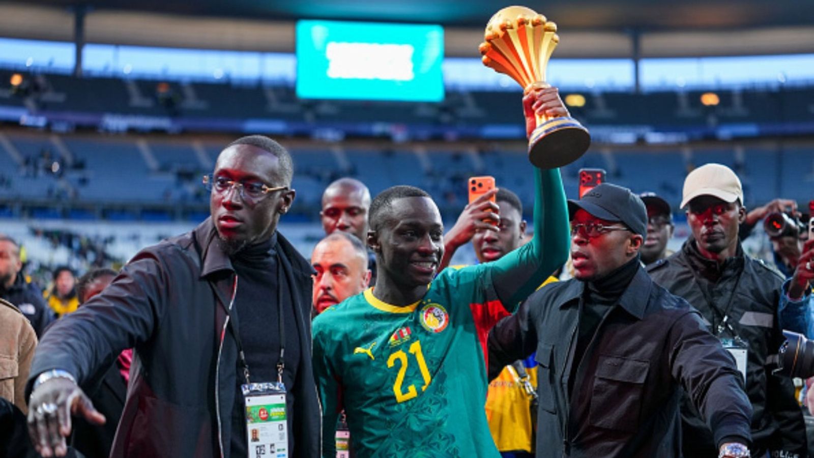Watch: Senegal parade AFCON trophy ahead of game amid CAF ruling Senegal team celebrating AFCON title in the frame (Image via Getty)