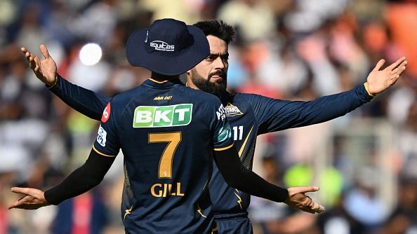 Gujarat Titans' Rashid Khan (R) celebrates with captain Shubman Gill (Getty)