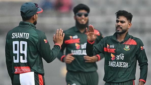 Bangladesh's Mehidy Hasan Miraz (R) celebrates with teammates after taking the wicket of Pakistan's Shaheen Shah Afridi during the first one-day international (ODI) (Getty)