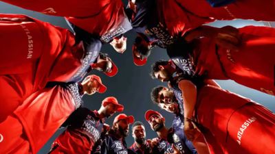 'Just a run-feeder, they will suffer': Former India star blasts RCB bowler after RR hammering RCB players in a huddle in this frame. (IPL)