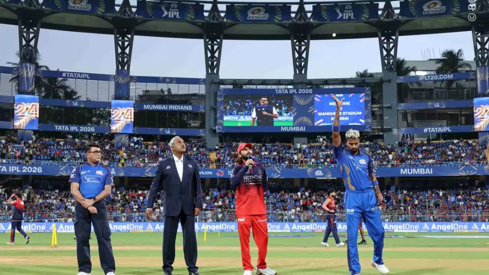Revealed: Why RCB, MI players are sporting black armbands during IPL 2026 clash at Wankhede Hardik Pandya and Rajat Patidar at toss (IPL/BCCI)