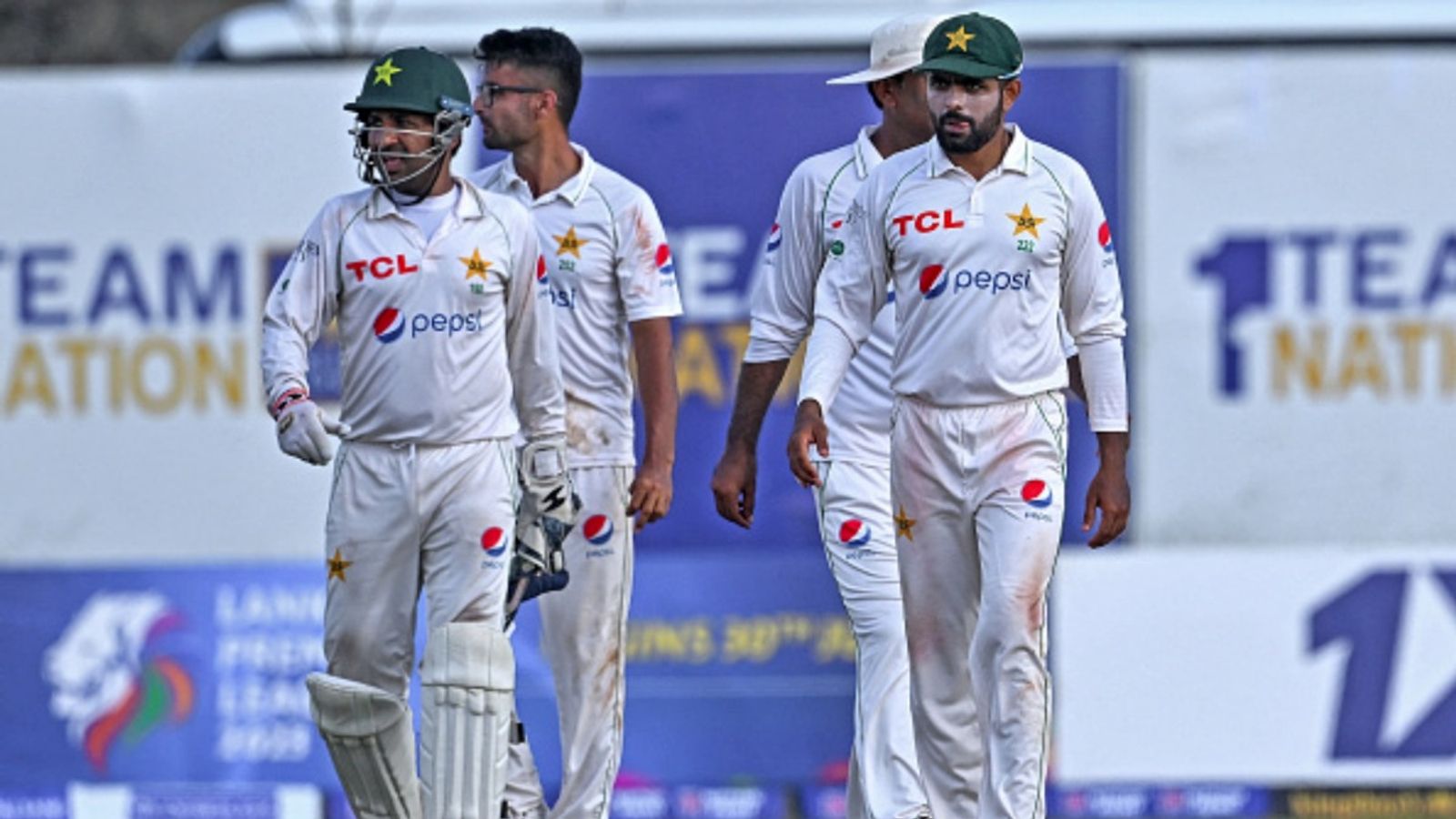 Pakistan announce Sarfaraz Ahmed as new head coach, include 4 uncapped players for Tests vs Bangladesh Pakistan's Babar Azam (R) and wicketkeeper Sarfaraz Ahmed (L) with teammates walk back to the pavilion at the end of fourth day of the first Test against Sri Lanka at the Galle International Cricket Stadium on July 19, 2023.