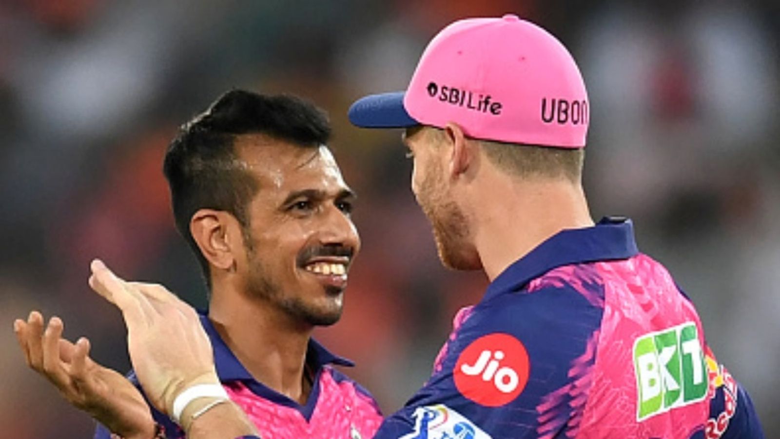 No place for Rohit, Chahal, Jadeja & Bravo in Buttler's all-time IPL XI feat. 2 non-title winners Rajasthan Royals' Yuzvendra Chahal (L) celebrates with teammate Jos Buttler after taking the wicket of Sunrisers Hyderabad's Mayank Agarwal during the IPL match at the Rajiv Gandhi International Cricket Stadium in Hyderabad on April 2, 2023.