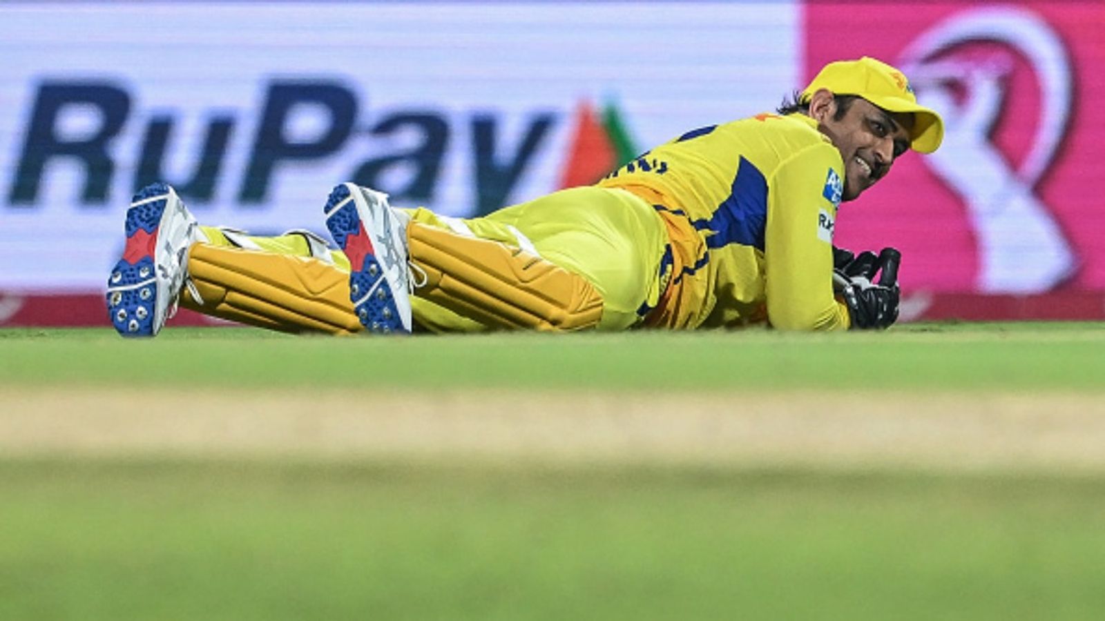 CSK travel to Delhi without MS Dhoni, wait for legend's 1st game in IPL 2026 continues: Report Chennai Super Kings' MS Dhoni falls on the ground while fielding the ball during the Indian Premier League (IPL) match against Mumbai Indians at the MA Chidambaram Stadium in Chennai on March 23, 2025.