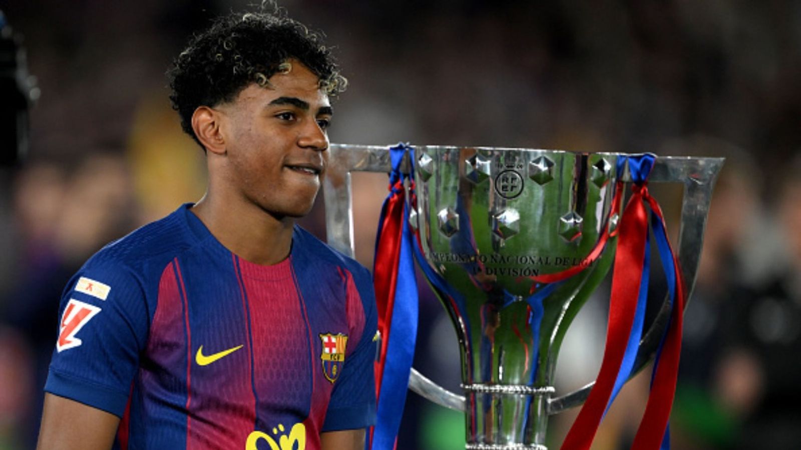 Watch: Barcelona star Lamine Yamal provokes Real Madrid fans with controversial shirt during title parade Lamine Yamal in the frame (Image via Getty)