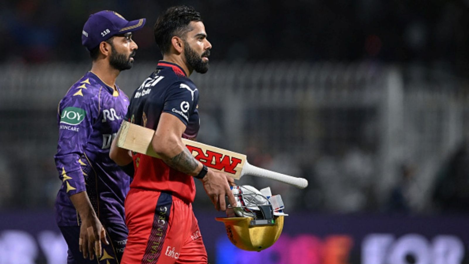 RCB vs KKR Head-to-Head Record, Probable XIs, Pitch Report & Weather Forecast RCB's Virat Kohli (R) and KKR captain Ajinkya Rahane look on at the end of the IPL match at the Eden Gardens in Kolkata on March 22, 2025.