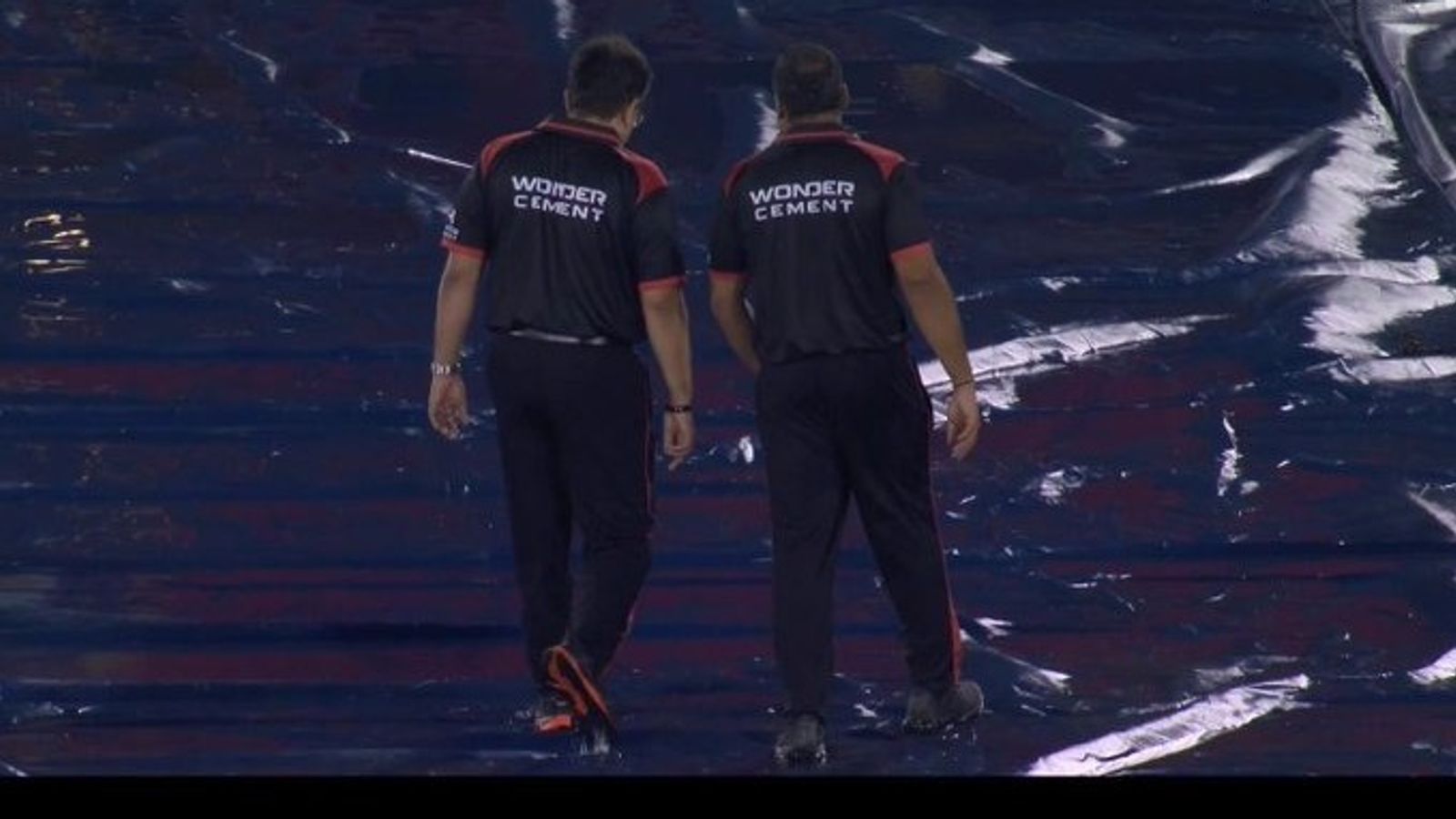 IPL 2026: Cut-off timings revealed after rain delays toss at RCB vs KKR clash Onfield umpires evaluating the venue. (Screengrab)