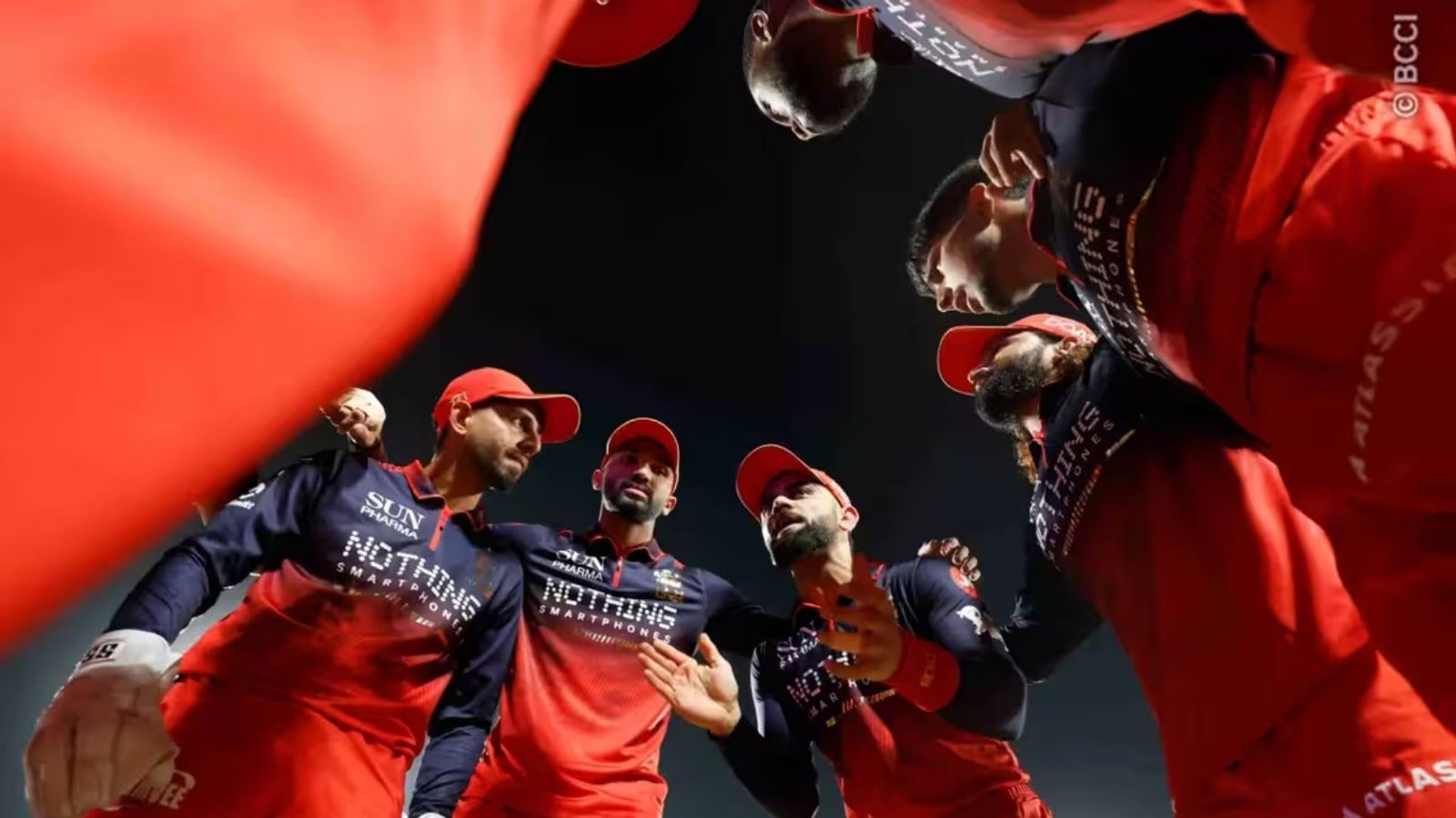 Why Rajat Patidar is not playing against Punjab Kings in Dharamsala encounter? Virat Kohli talks to his RCB teammates during team huddle. (Photo Credit: BCCI)
