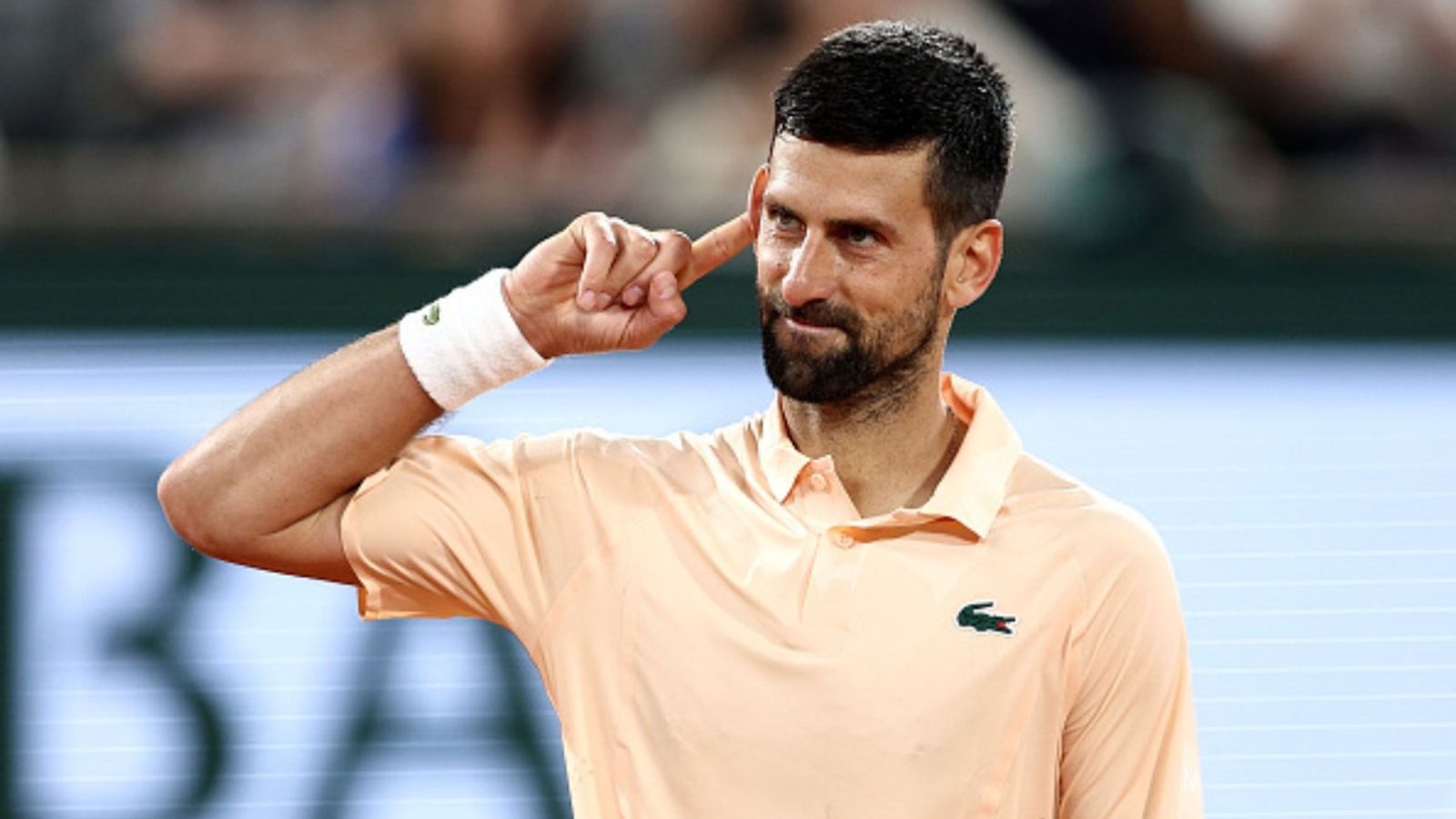 Watch: Novak Djokovic overcomes first-round scare at Roland Garros 2026; celebrates with playful dance Novak Djokovic in the frame (Image via Getty)
