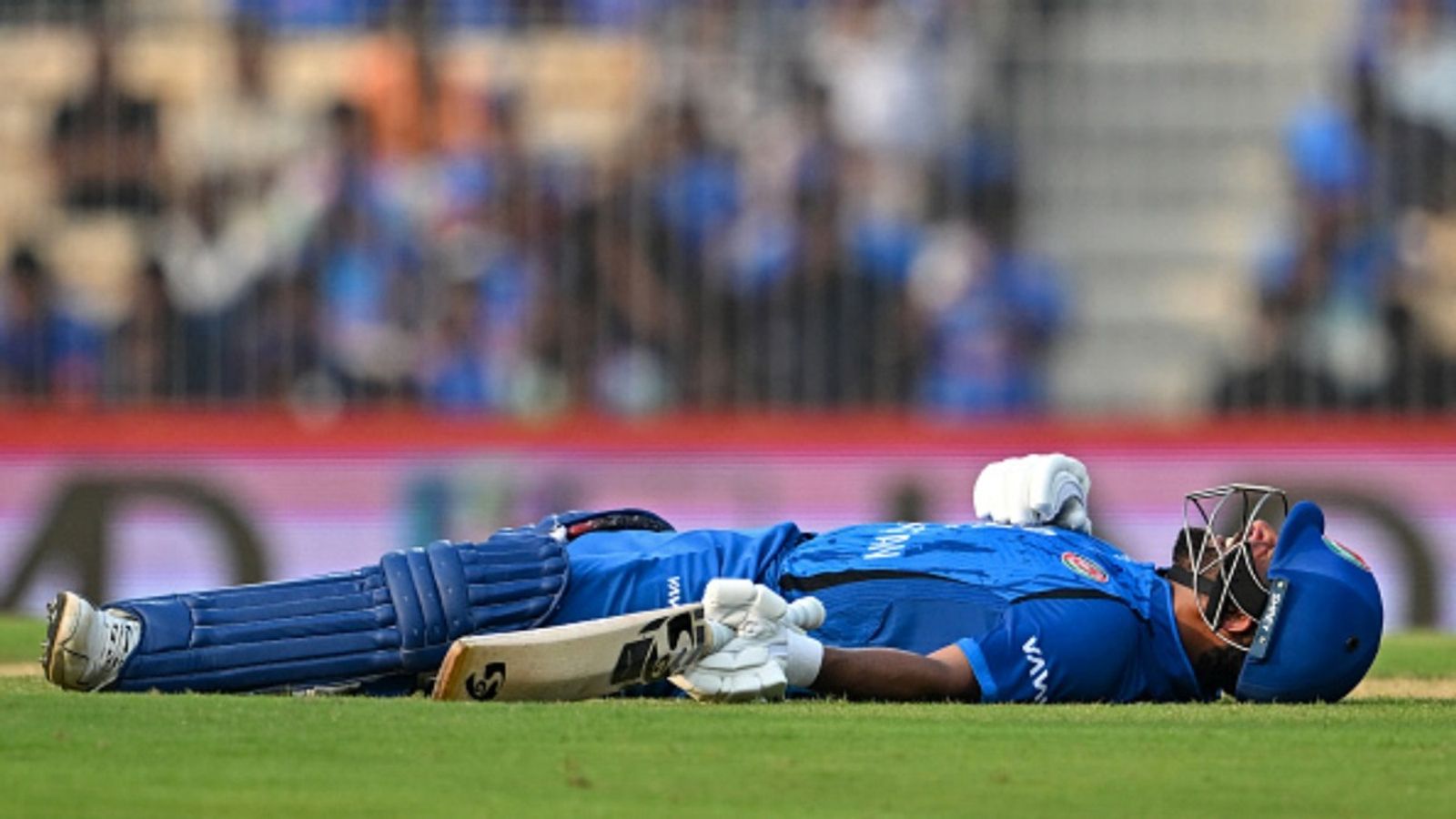 Afghanistan skipper faces ICC action after maiden ODI century vs India for violating Code of Conduct Afghanistan's captain Hashmatullah Shahidi reacts as he suffers cramps on his forearms during the third ODI against India at the MA Chidambaram Stadium in Chennai on June 20, 2026.