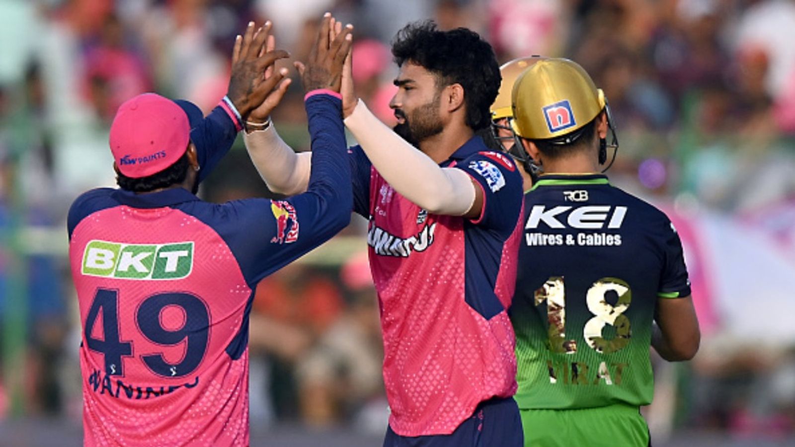 Released by RR, unsold in IPL 2026 mini-auction, left-arm spinner bags 6/24 including hat-trick Kumar Kartikeya (C) of Rajasthan Royals celebrates the wicket of Phil Salt of Royal Challengers Bengaluru with teammate during the 2025 IPL match at Sawai Mansingh Stadium on April 13, 2025, in Jaipur, India.