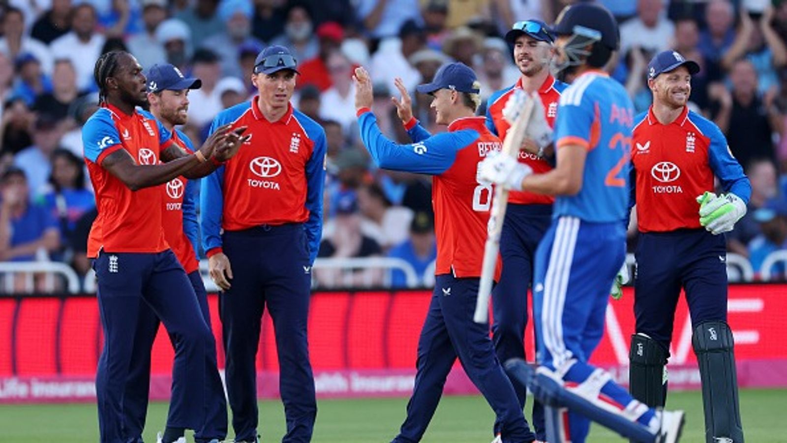 IND vs ENG: India slump to their biggest T20I defeat as England script 125-run triumph to lead series 2-0 England's Jofra Archer celebrates with his teammates after taking the wicket of India's Axar Patel in this frame. (Getty)