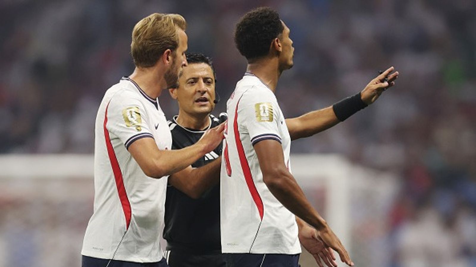 Massive setback for England, star defender banned for 2 matches ahead of showdown against Norway England captain Harry Kane (L) consoles his teammate Jarell Quansah after receiving a red card in this frame. (Getty)