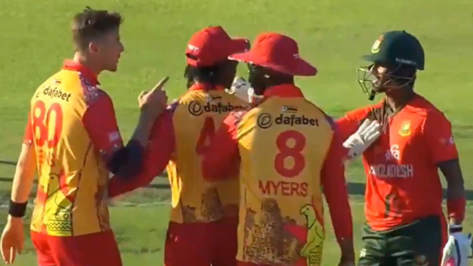 Zimbabwe pacer furious as Bangladesh opener's wild celebration leads to heated exchange in tense finish to series decider; watch video Zimbabwe's Brad Evans loses his cool as teammates Tadiwanashe Marumani, Dion Myers and Bangladesh batter Mahedi Hasan try to pacify him in third T20I of the series.