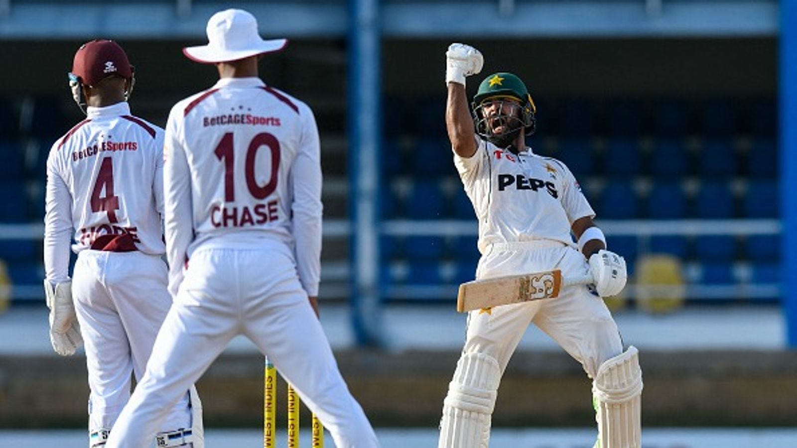 Pakistan end 8-match away Test losing streak with eight-wicket win over WI to level series 1-1 Pakistan's Abdullah Shafique (R) celebrates as West Indies players look on. (Getty)