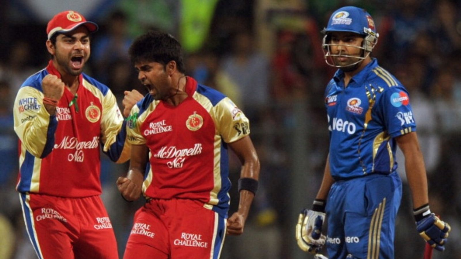 Ex-India pacer with 504 first-class wickets set to become Karnataka's new head coach RCB captain Virat Kohli (L) celebrates with fast bowler Vinay Kumar (C) after taking the wicket of MI batter Rohit Sharma (R) during the IPL match at The Wankhede Stadium in Mumbai on May 9, 2012.