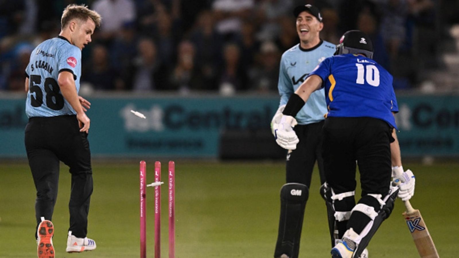 First-class cricket's 1st concussion substitute, England's 30-year-old all-rounder retires after medical advice Sam Curran of Surrey kicks the ball against the stumps but Danny Lamb of Sussex makes his ground during the T20 Blast Men's match at The 1st Central County Ground on July 18, 2025 in Hove, England.
