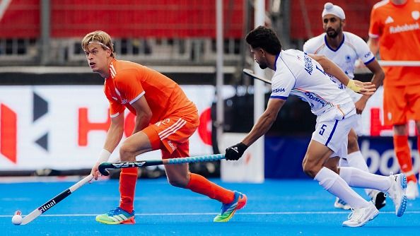 (L-R) Justen Blok of Netherlands, Abhishek of India  during Hockey World Cup 2026. (Getty)