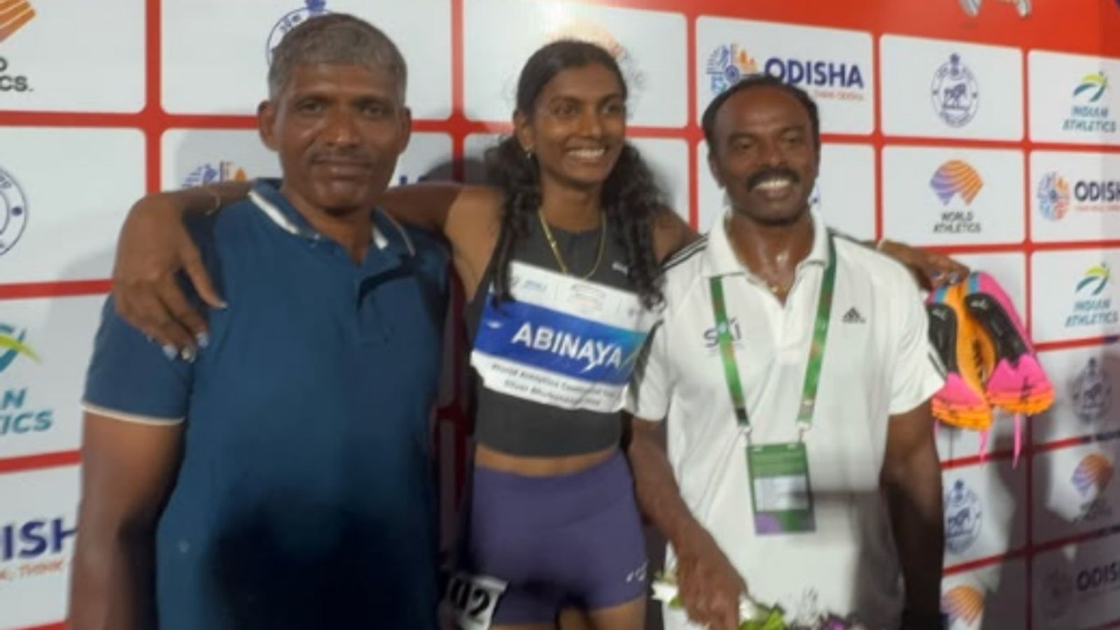 Stretchered off the track in February, Abinaya Rajarajan breaks U20 100m record by clocking 11.34 seconds Abinaya Rajarajan poses for a photo with her father and mentor after winning the race.