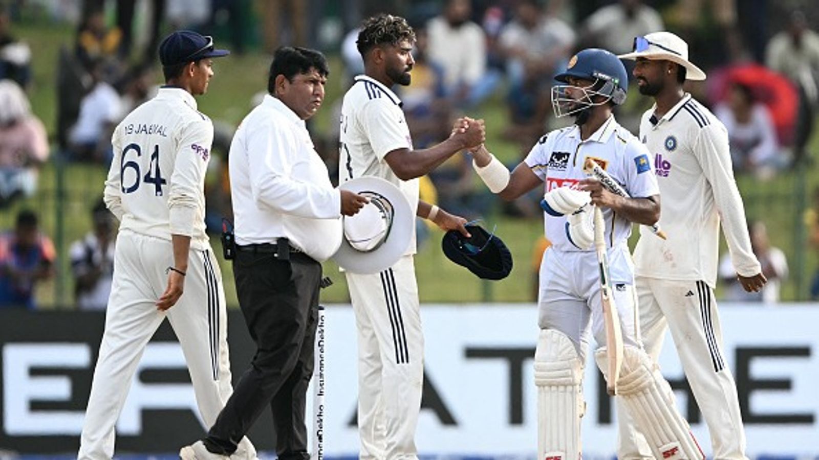 WTC Points Table 2025-27: Updated standings after India vs Sri Lanka Colombo Test draw Sri Lanka's Sonal Dinusha (2R) shakes hands with India's Mohammed Siraj (C) after second Test ended in a draw. (Getty)